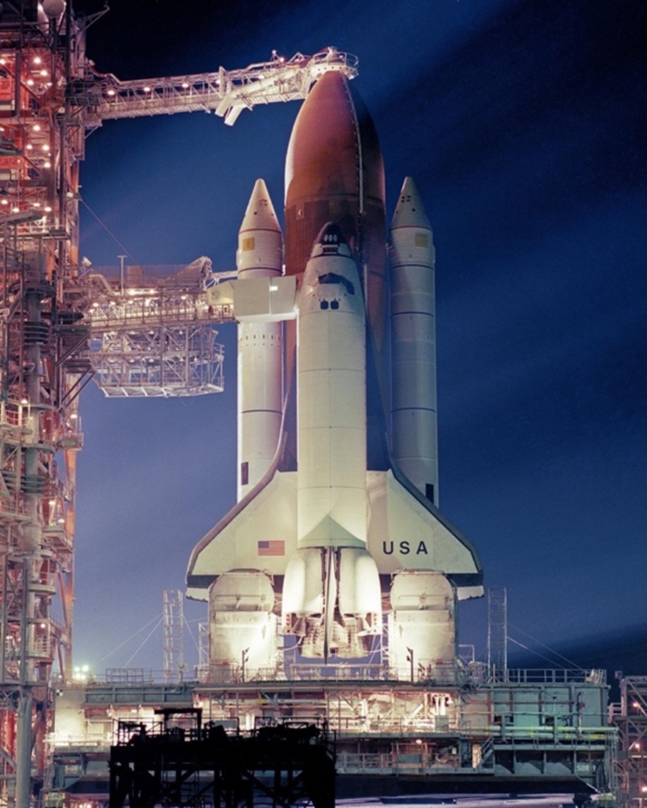 Figure 1. Space Shuttle Columbia is illuminated with floodlights on Launch Pad 39A during loading tests prior to the launch of STS-3. 